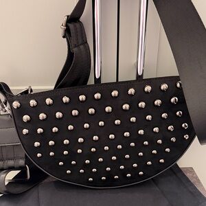 Think Royln cross body bag with adjustable strap and leather strap